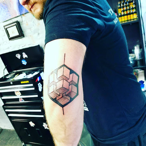 Explore dirtbike tattoo idea, creative tattoo ideas in Mebane, available at The Cardinal Skin Art & Gallery