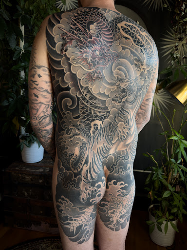 Explore back tattoo ideas men, creative tattoo ideas in Pocatello, available at Tattoos by Cherise
