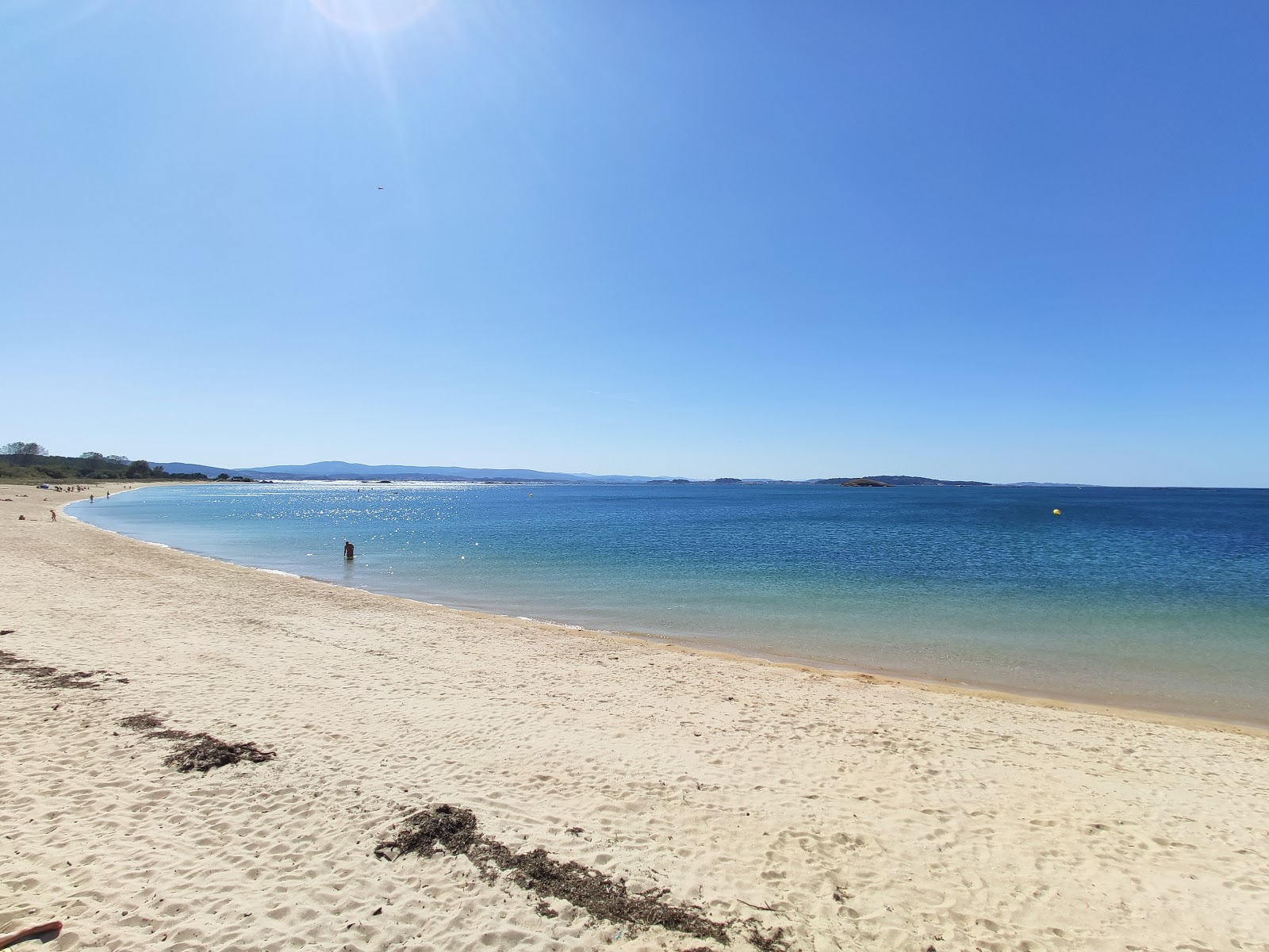 Foto av Carragueiros beach med små beige småsten yta
