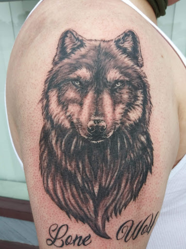 Explore cross hand tattoo ideas, creative tattoo ideas in Shelbyville, available at Stage Left Tattoo and Piercing