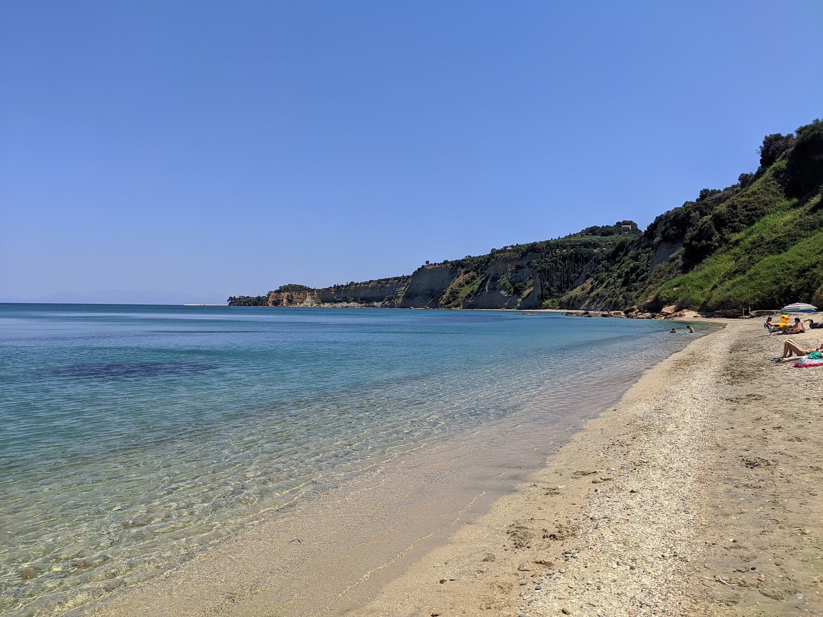 Photo of Agia Triada beach with turquoise pure water surface