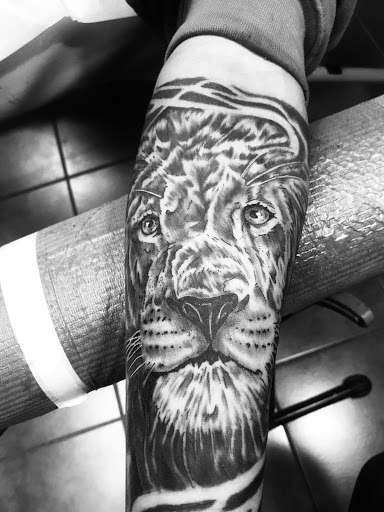 Explore tribal dragon tattoo ideas, creative tattoo ideas in Aurora, available at Ronin Tattoo Studio INC