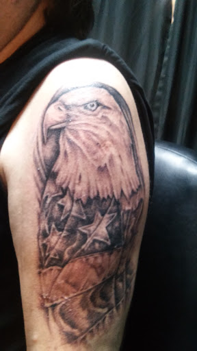 Explore religious cross tattoo ideas, creative tattoo ideas in Orange Park, available at All Aces Tattoo and Body Piercing LLC