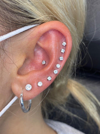 Find palm size tattoo ideas for females for your next unique tattoo in Bay Shore at Piercings By Dean 95