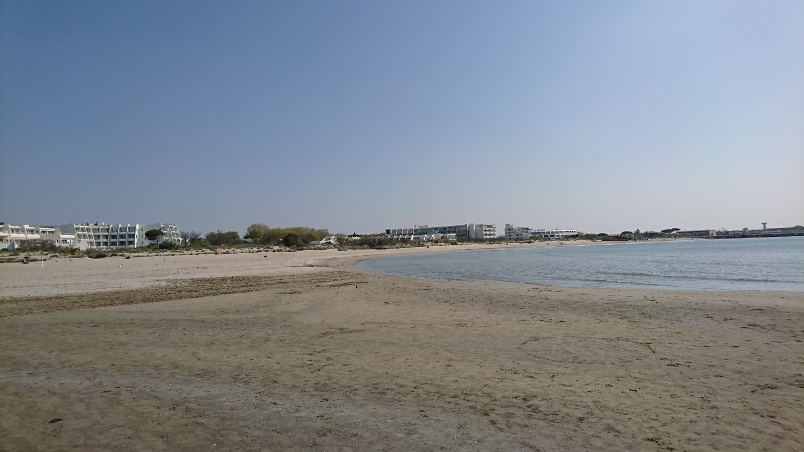 Foto von Azur Strand und die siedlung