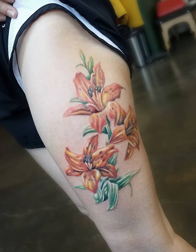 Explore football tattoo ideas, creative tattoo ideas in Renton, available at Handsome Devil Ink