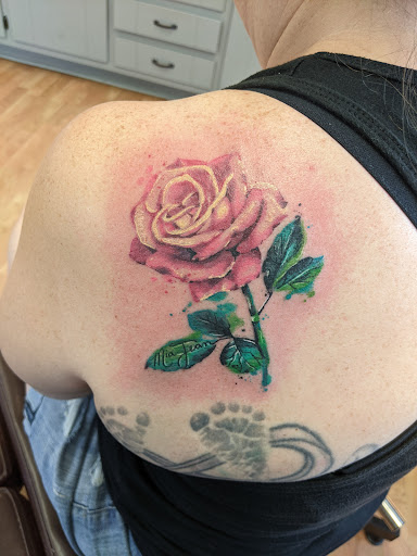 Explore black male tattoo ideas, creative tattoo ideas in Green Bay, available at Tattoo Nouveau