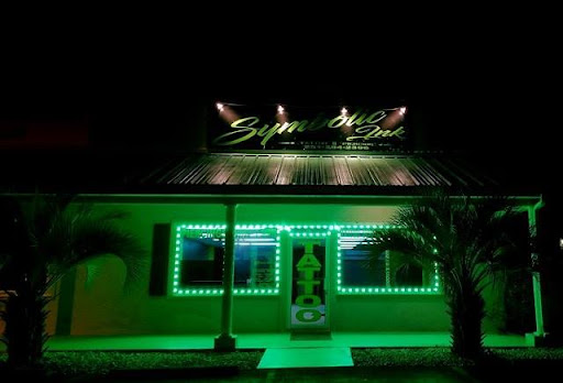 Explore pisces tattoo ideas, creative tattoo ideas in Foley, available at Symbolic Ink Tattoo Studio