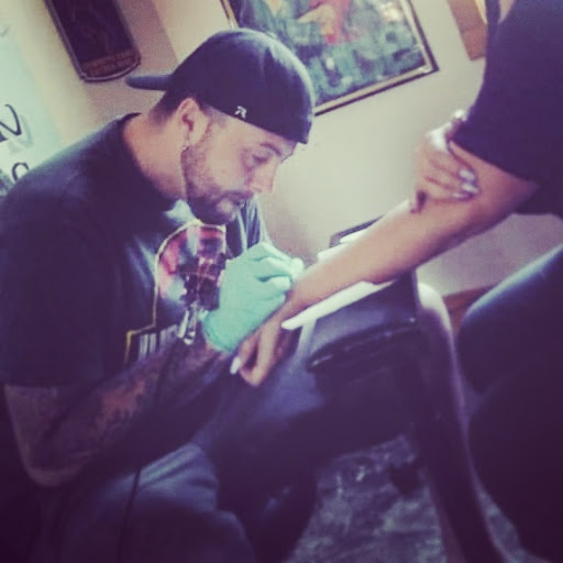 Explore trap house tattoo ideas, creative tattoo ideas in Lander, available at Blackblood Tattoo and Piercing