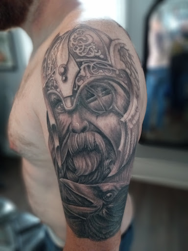 Explore wedding band tattoo ideas for him, creative tattoo ideas in Shelby, available at Shiny New Tattoo