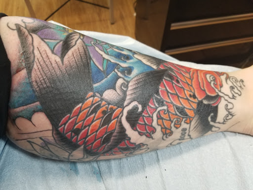 Explore ocean sleeve tattoo ideas, creative tattoo ideas in Orlando, available at Cast Iron Tattoos