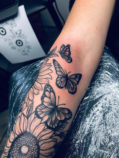 Explore deer antler tattoo ideas, creative tattoo ideas in North Tonawanda, available at Dark Side Ink Tattoo Studio