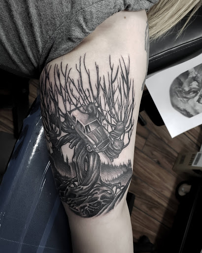 Explore animal skull tattoo ideas, creative tattoo ideas in Calhoun, available at A Sailors Grave Tattoo Parlor