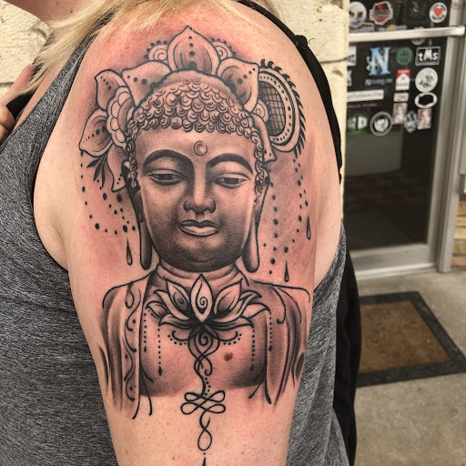 Explore upper arm men tattoo ideas, creative tattoo ideas in Junction City, available at New Era Tattoo Studio