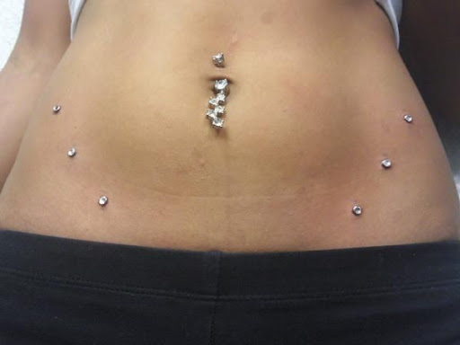 Explore hair stylist tattoo ideas, creative tattoo ideas in Elko, available at Tom Custom Tattoos and Body Piercing Studio