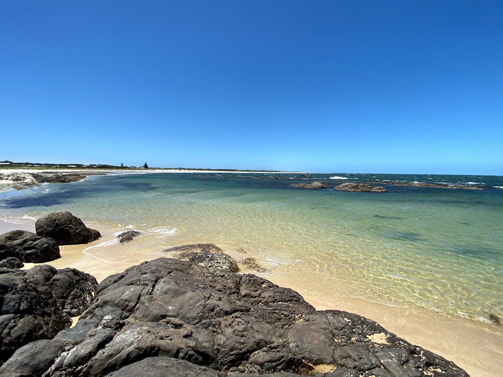 Foto di Windy Beach con baia lunga