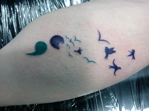 Explore chicano neck tattoo ideas, creative tattoo ideas in Kannapolis, available at Ink Station Tattoo Studio