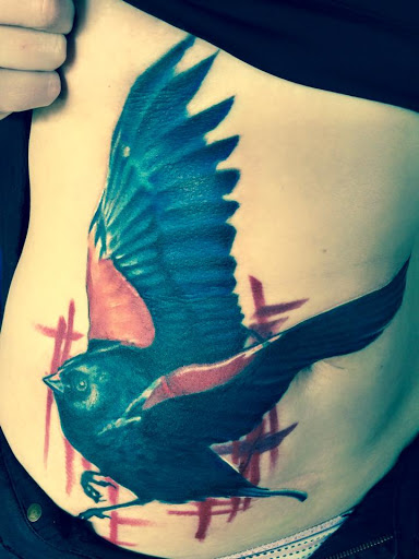 Explore dark skin male black skin tattoo ideas, creative tattoo ideas in Dayton, available at RocArt Tattoo & Piercing