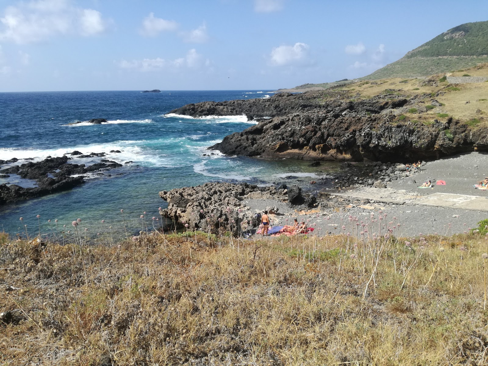 Foto av Caletta Acquario med blå rent vatten yta