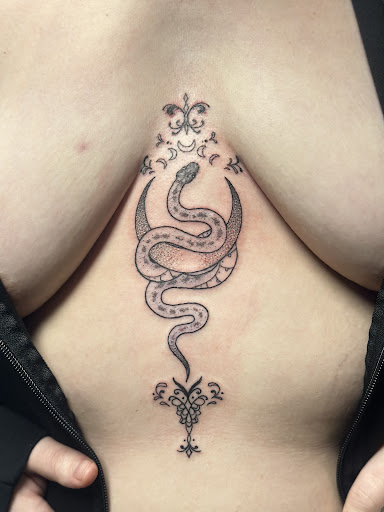 Explore broken chain tattoo ideas, creative tattoo ideas in Merrillville, available at Sacred Moon Private Tattoo Studio