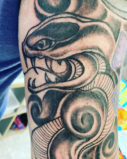 Find small cat tattoo ideas for your next unique tattoo in Coram at Asylum Tattoo