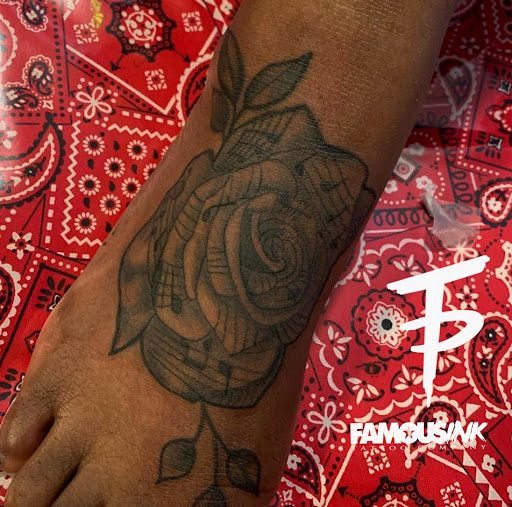 Explore rose tattoo idea, creative tattoo ideas in Hammond, available at Famous Ink, Inc.