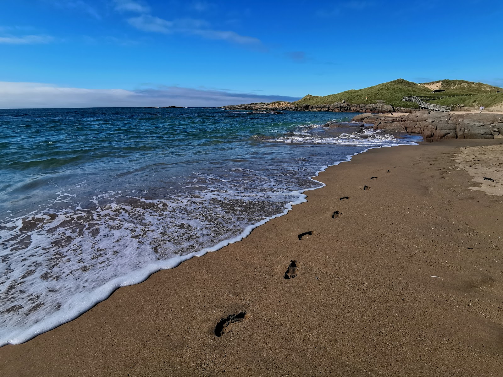 Valokuva Mullaghderg Beachista. pinnalla turkoosi puhdas vesi:n kanssa