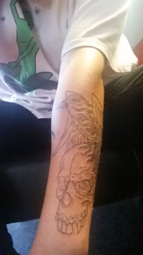 Explore feather tattoo ideas for men, creative tattoo ideas in Boaz, available at Skin Deep Tattoo & Piercing Studio