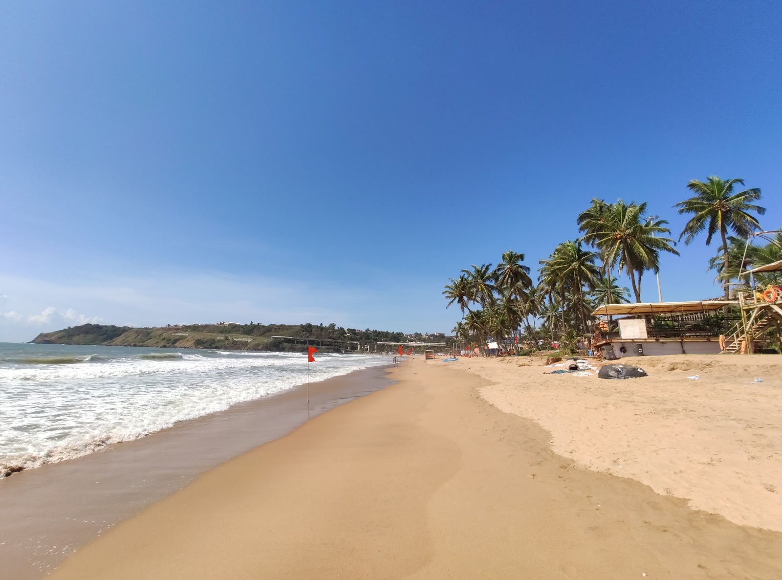 Fotografija Baina Beach z svetel pesek površino