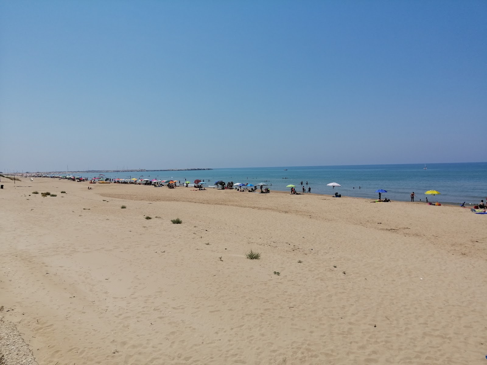 Fotografie cu Spiaggia La Lanterna și așezarea