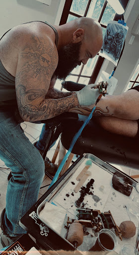 Explore left hand tattoo ideas, creative tattoo ideas in Gautier, available at Voodoo Tattoo