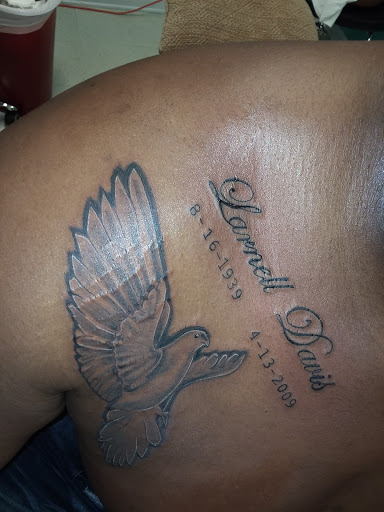 Explore mens back tattoo ideas, creative tattoo ideas in Roanoke Rapids, available at Greatful deadication tattoo and piercings