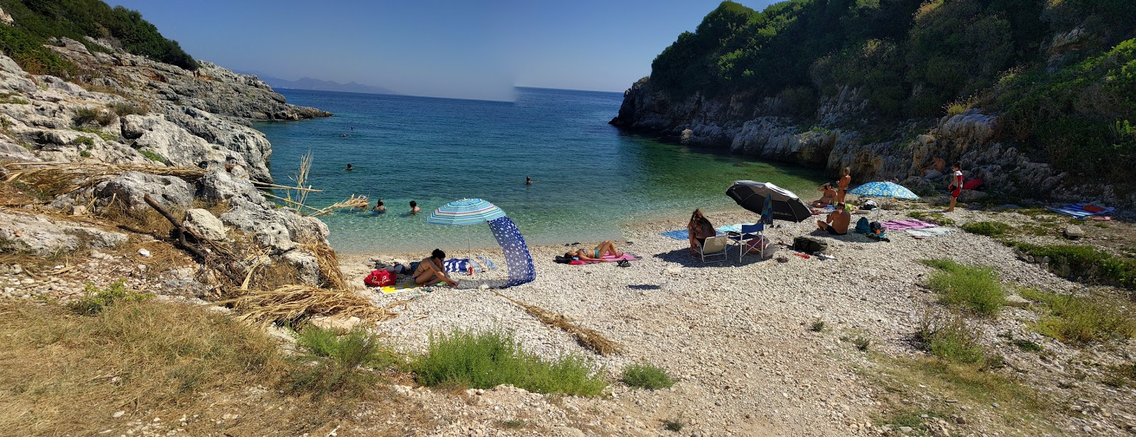 Photo of Climati beach backed by cliffs