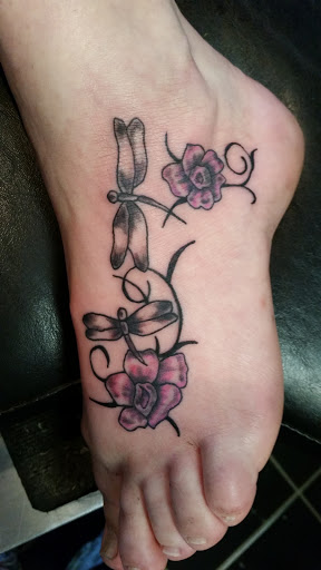 Explore tattoo ideas female thigh, creative tattoo ideas in Erie, available at EliKingInk