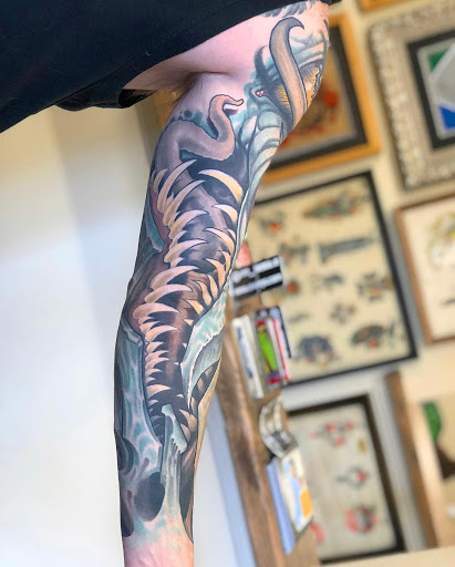 Explore tattoo ideas for lower abdomen, creative tattoo ideas in Arabi, available at Hidden Dimension Studio