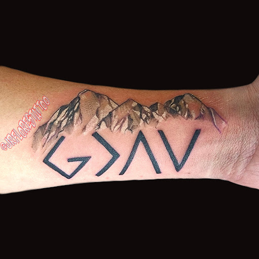 Explore chest cross tattoo ideas, creative tattoo ideas in Caldwell, available at Blue Ring Studio Tattoo & Piercing