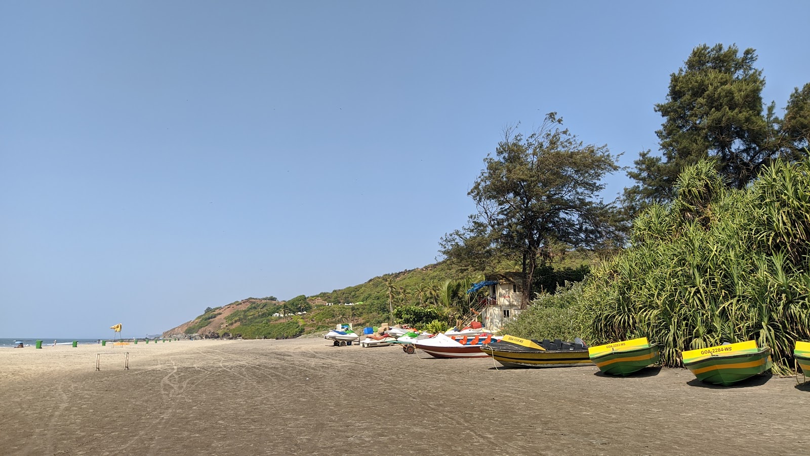 Photo of Vagator Beach backed by cliffs