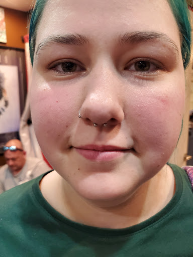 Explore female throat tattoo ideas, creative tattoo ideas in Myrtle Beach, available at Pitbull Tattoo and Piercing Clinic