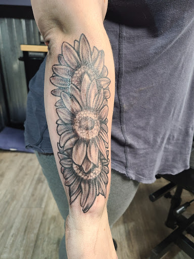 Explore ac dc tattoo ideas, creative tattoo ideas in Crown Point, available at Tainted Skin & Who Dun It Piercing Salon