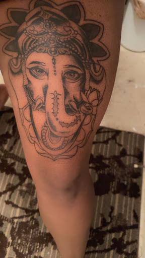 Explore red ink tattoo ideas for guys, creative tattoo ideas in Orlando, available at Evermore Tattoo Studio