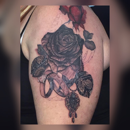 Explore solid black tattoo ideas, creative tattoo ideas in Savannah, available at Tatlyfe Studios