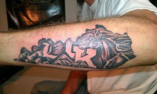 Explore flower ankle tattoo ideas, creative tattoo ideas in Bowling Green, available at Taboo Tattoos and Piercings