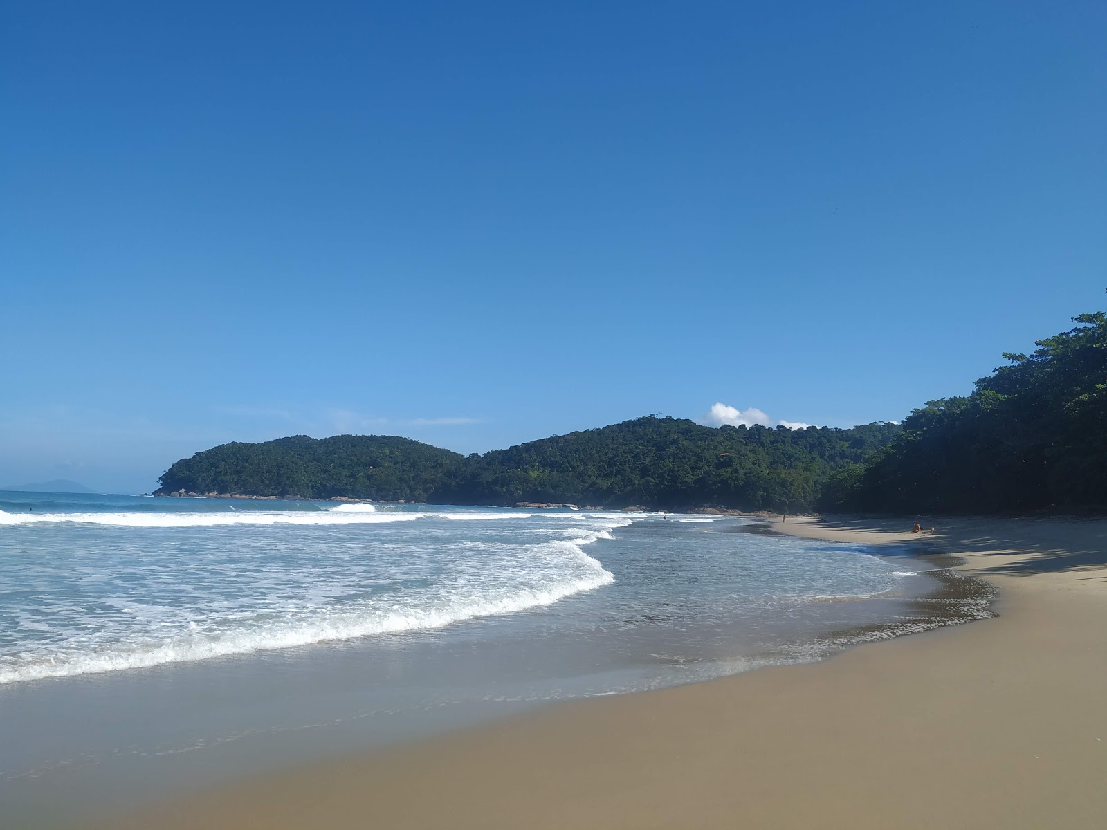 Photo de Plage de Conchas avec l'eau cristalline de surface