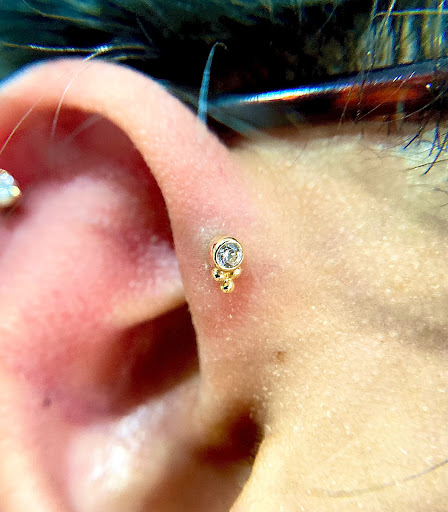 Find low back tattoo ideas for your next unique tattoo in Orange at Symbiosis Body Piercing