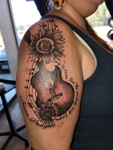 Explore name on neck tattoo ideas, creative tattoo ideas in Onalaska, available at Rock Bottom Tattoo Studio