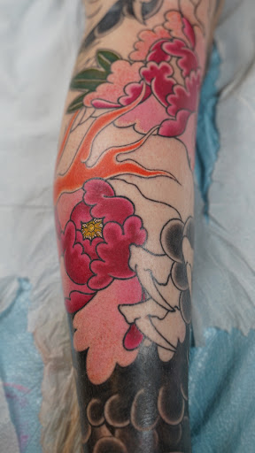 Find family of 3 tattoo ideas for your next unique tattoo in Arlington at Benchmark Tattoos