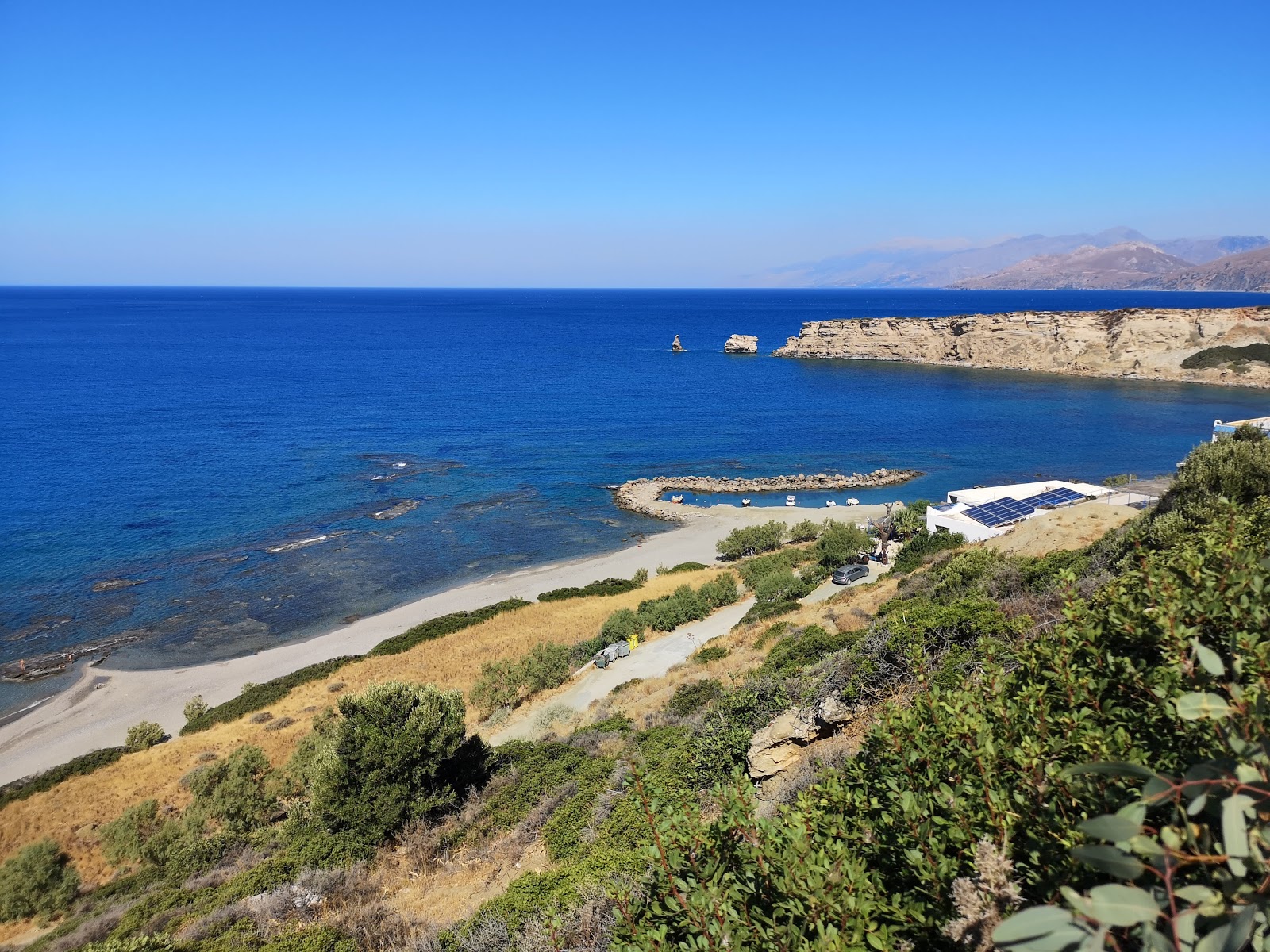 Photo of Triopetra beach backed by cliffs