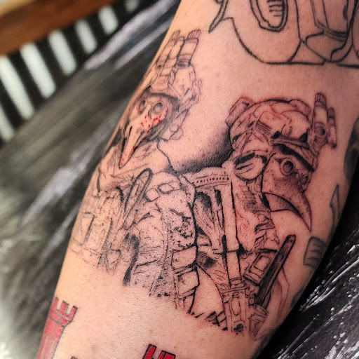 Explore black sleeve tattoo ideas, creative tattoo ideas in Minocqua, available at Whisky Rose Tattoo Parlor