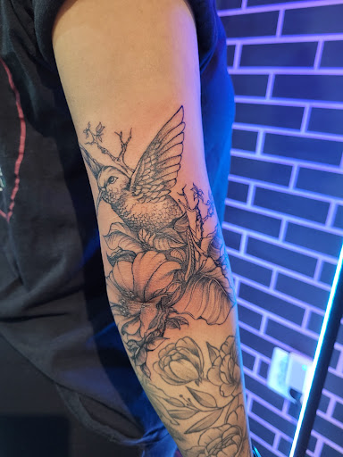 Explore arm cross tattoo ideas, creative tattoo ideas in Arlington, available at Lady Octopus Tattoos