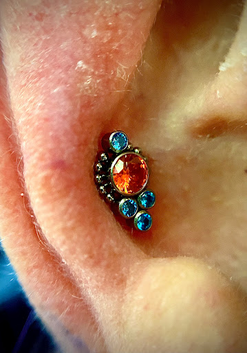 Find clouds tattoo ideas for your next unique tattoo in Orange at Symbiosis Body Piercing